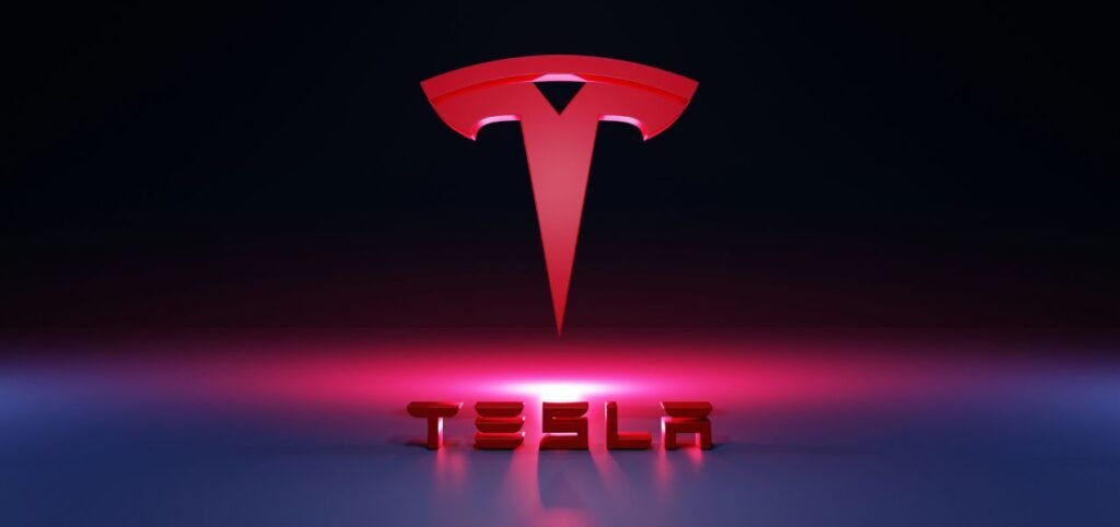 High-definition wallpaper featuring the Tesla logo, showcasing a sleek and modern design in vibrant colors.