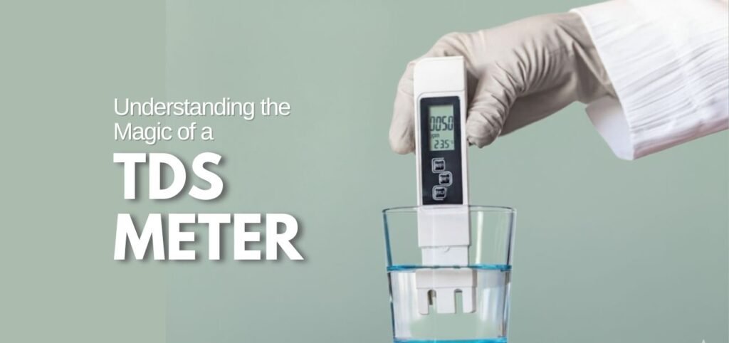 A gloved hand holds a TDS meter above a clear glass of water with reading displayed on the device.